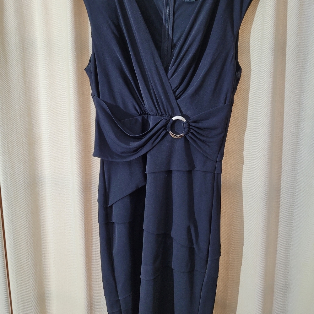 White House Black Market elegant black dress with circular pilished ring accent